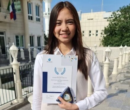Amanda holding her pearson award
